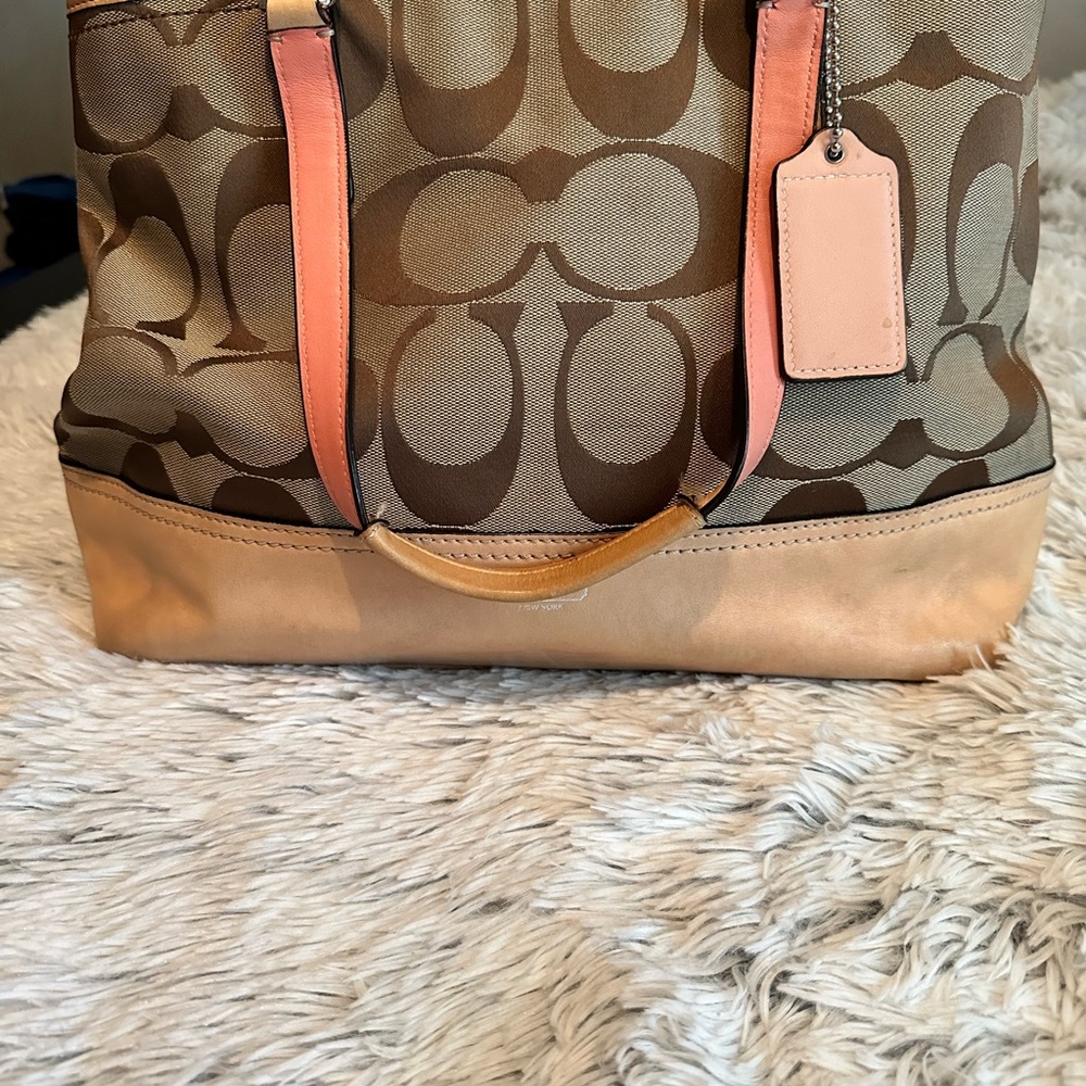Coach tan and pink with brown C’s, canvas and leather.